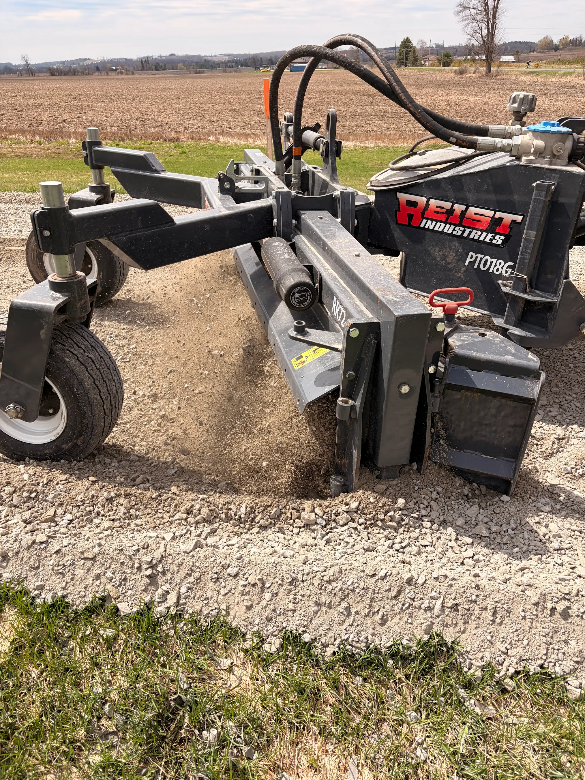 Gravel driveway grading and base preparation using heavy equipment